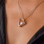 White Crystal and white gold heart decorated with small crystal pendant.